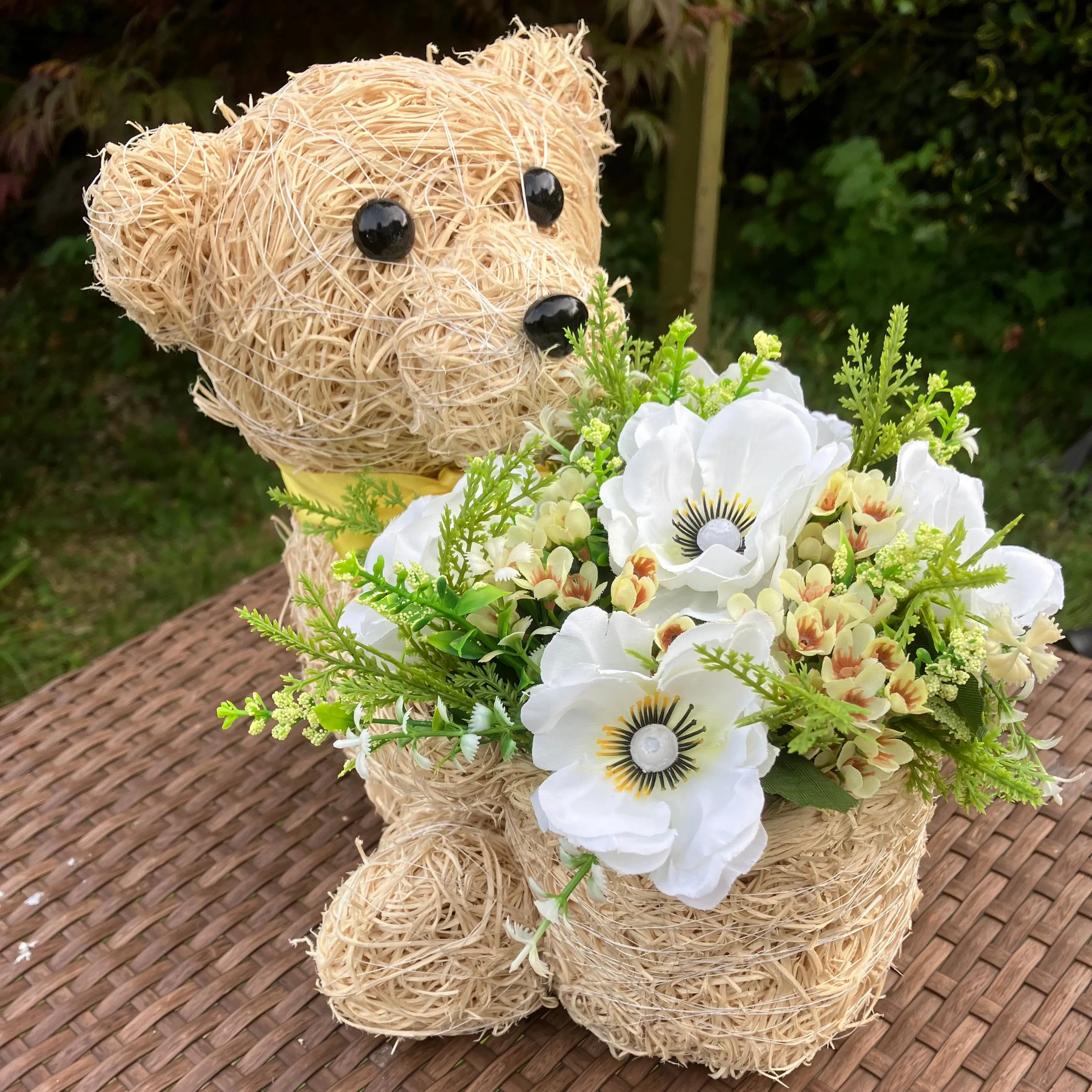 Child’s memorial teddy planter with yellow and cream artificial flowers