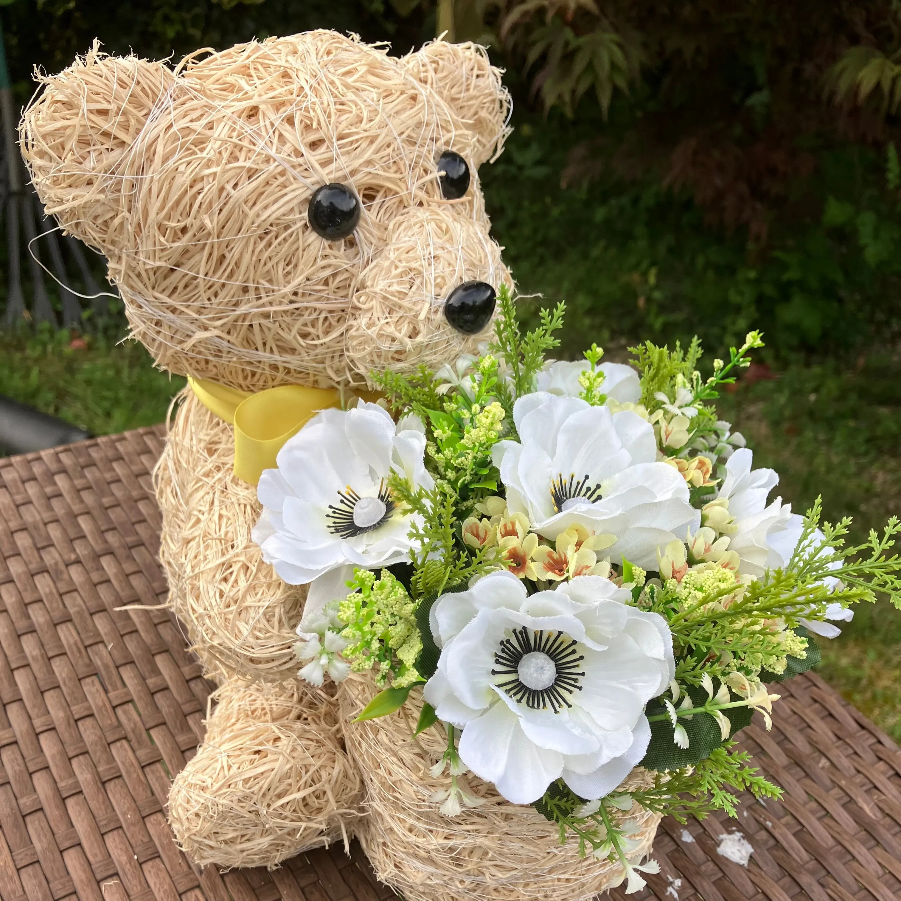 Child’s memorial teddy planter with yellow and cream artificial flowers