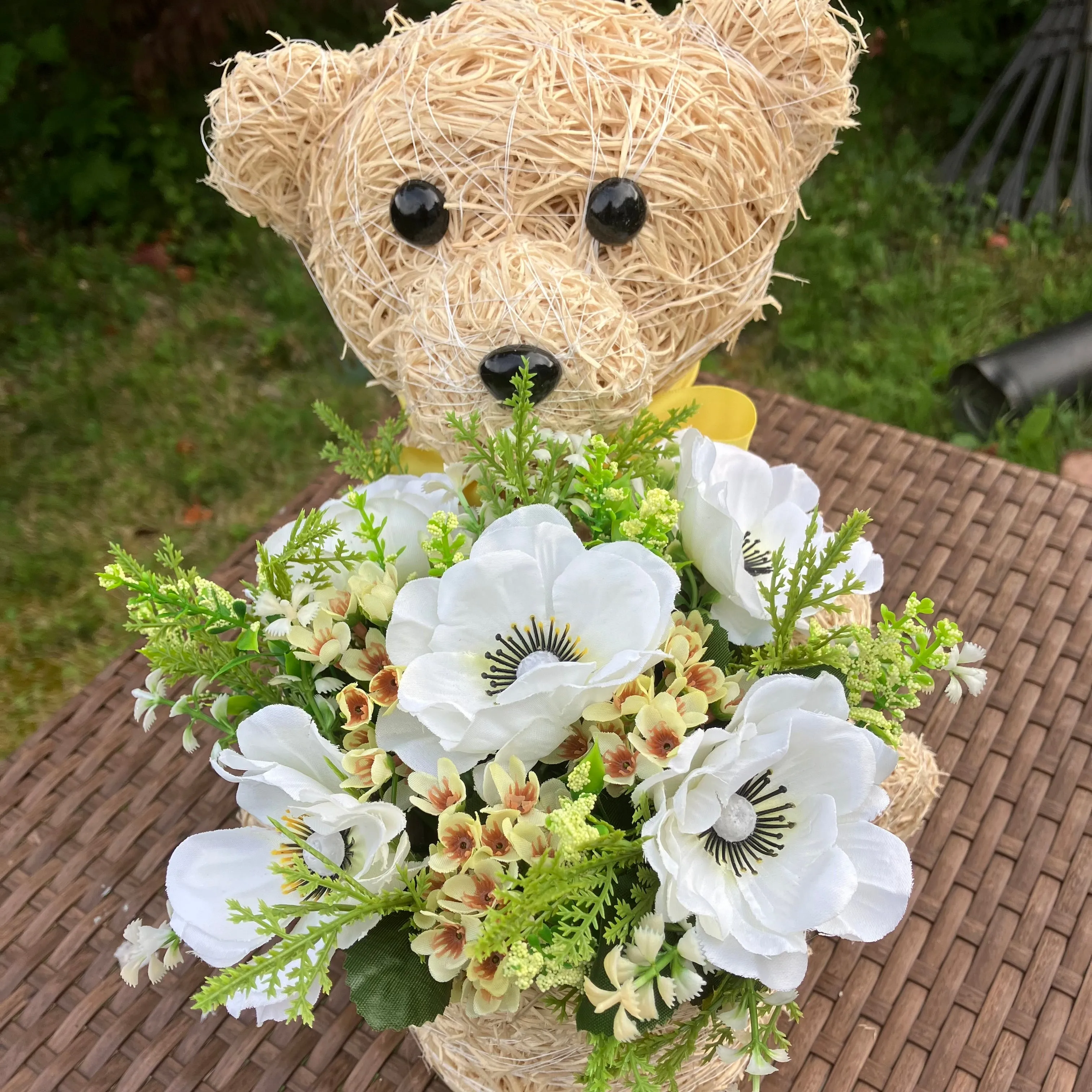 Child’s memorial teddy planter with yellow and cream artificial flowers