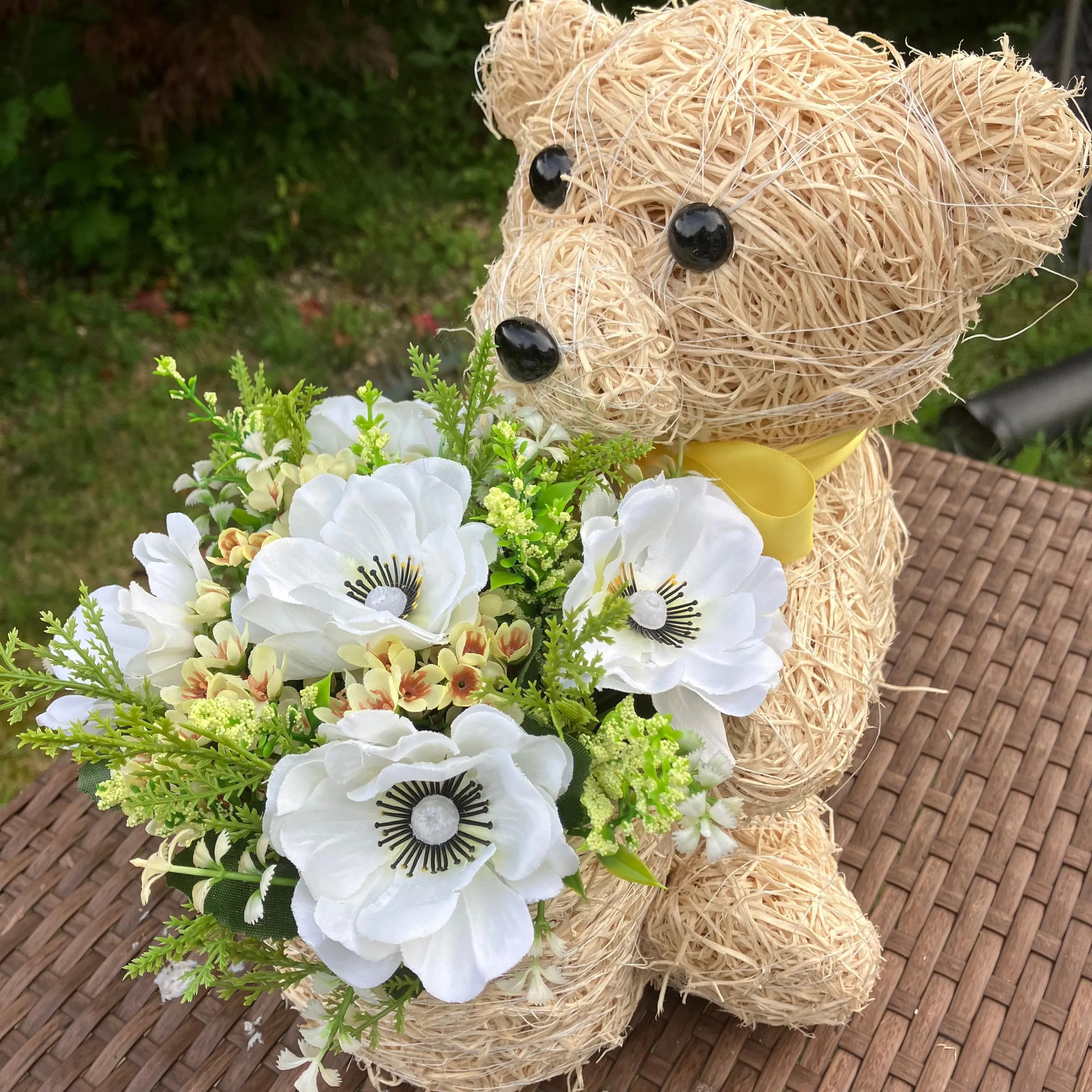 Child’s memorial teddy planter with yellow and cream artificial flowers